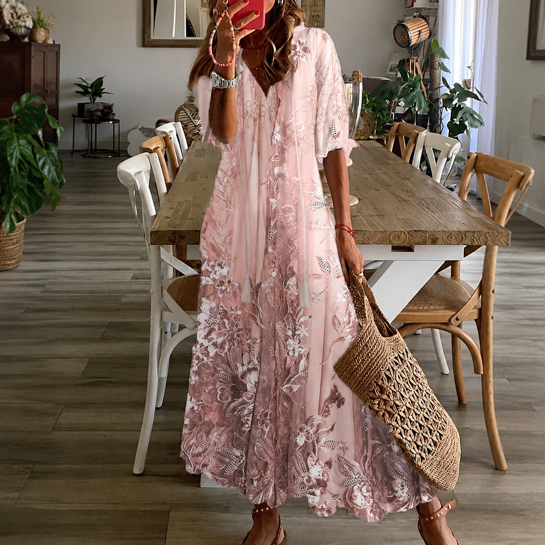 Women's floral print maxi dress with split neck and half sleeves, ideal for summer casual wear or garden parties.