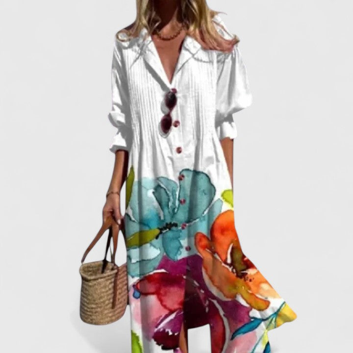 Close-up of elegant pintuck pleats on a women's floral print midi shirtdress, adding texture and style.