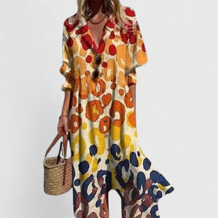 Vibrant floral print fabric on a women's button-down midi shirtdress, showcasing summer elegance.