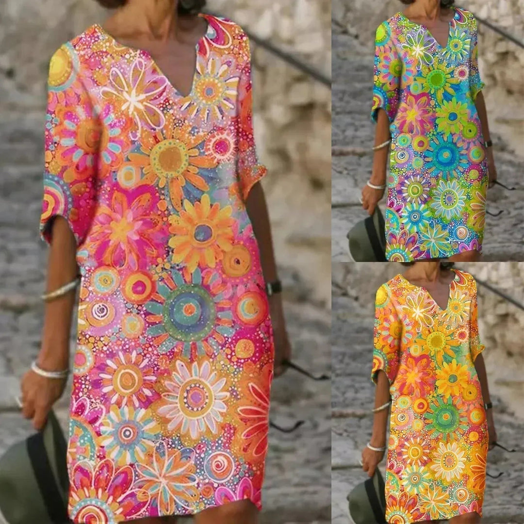 Vibrant floral midi summer dress for women, perfect beach or casual day wear with effortless style.