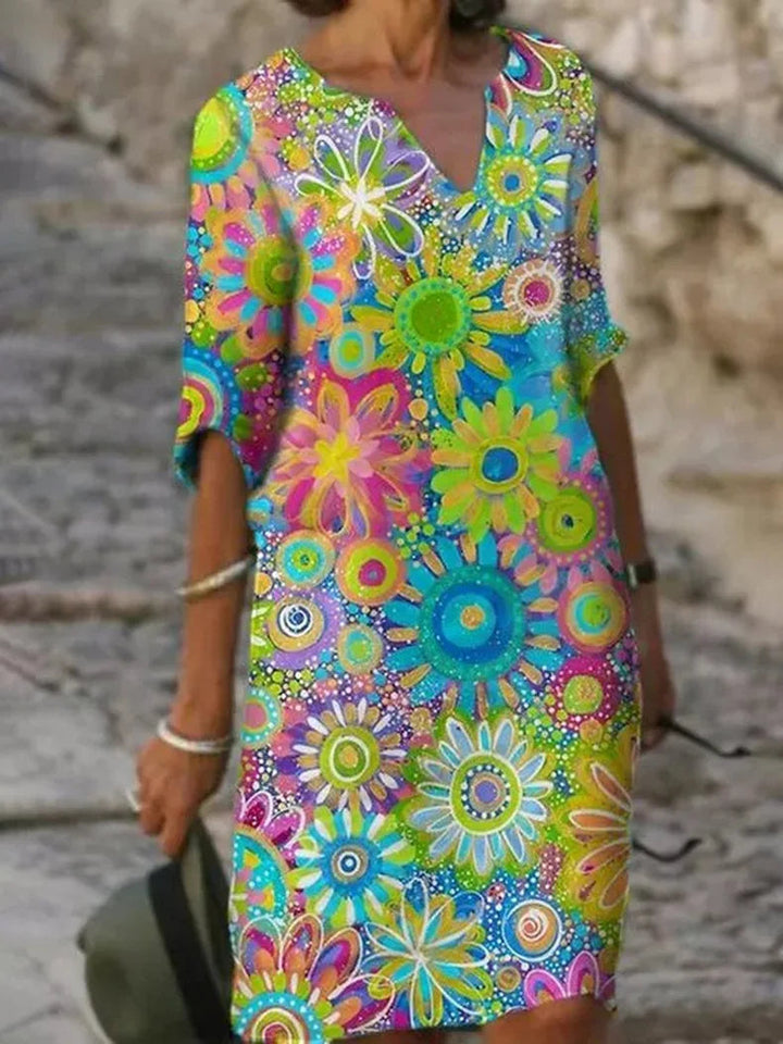 Comfortable women's floral print summer midi dress with half sleeves, great for vacation outfits.