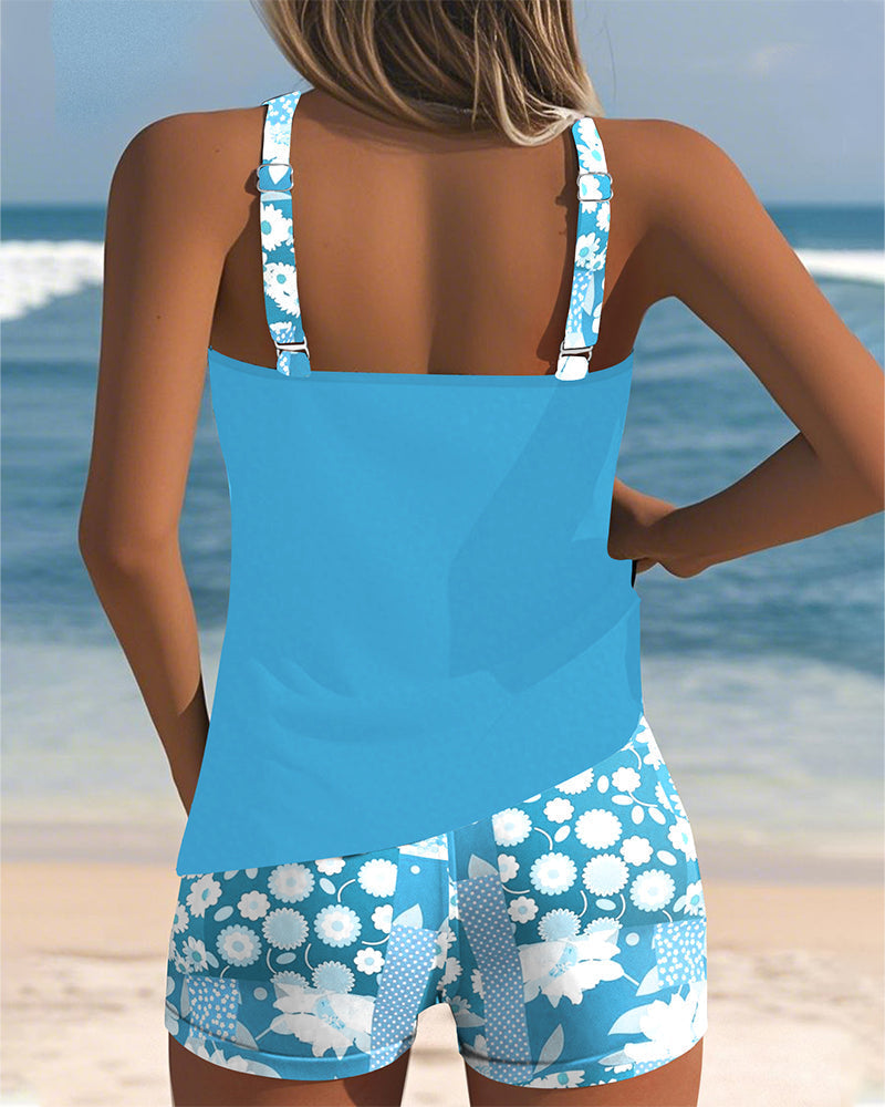 Complete women's floral tankini swimsuit set including a top and matching swim shorts.