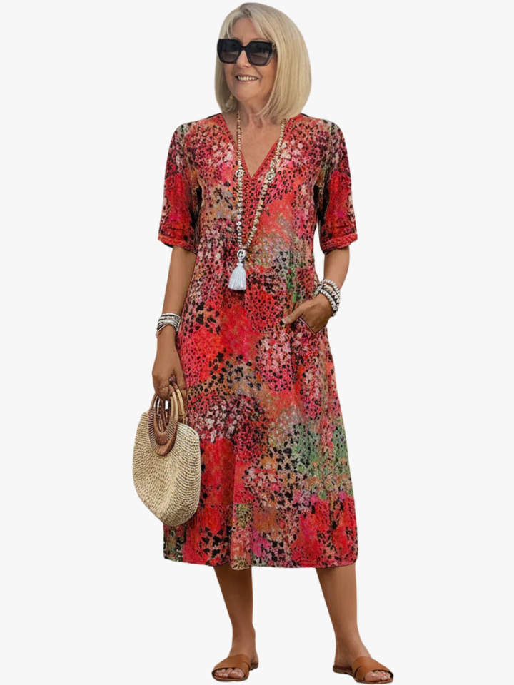 Women's floral print V-neck midi dress, perfect for casual summer style. Feminine A-line design for everyday comfort.