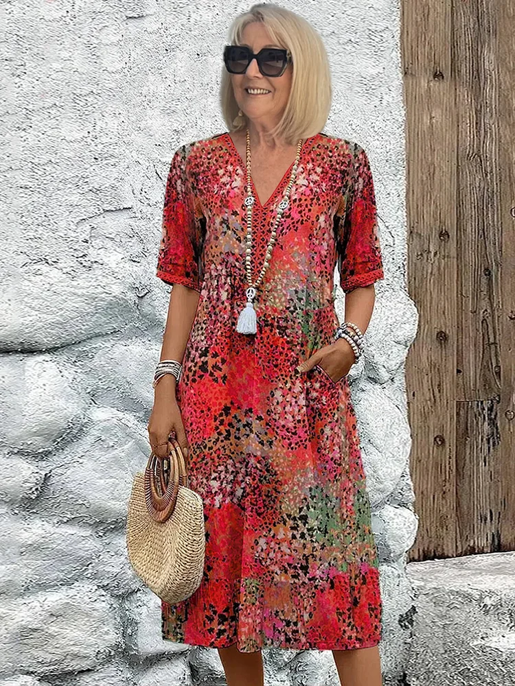 Versatile women's midi dress with vibrant floral print & elegant V-neck. Ideal for effortless summer outfits.