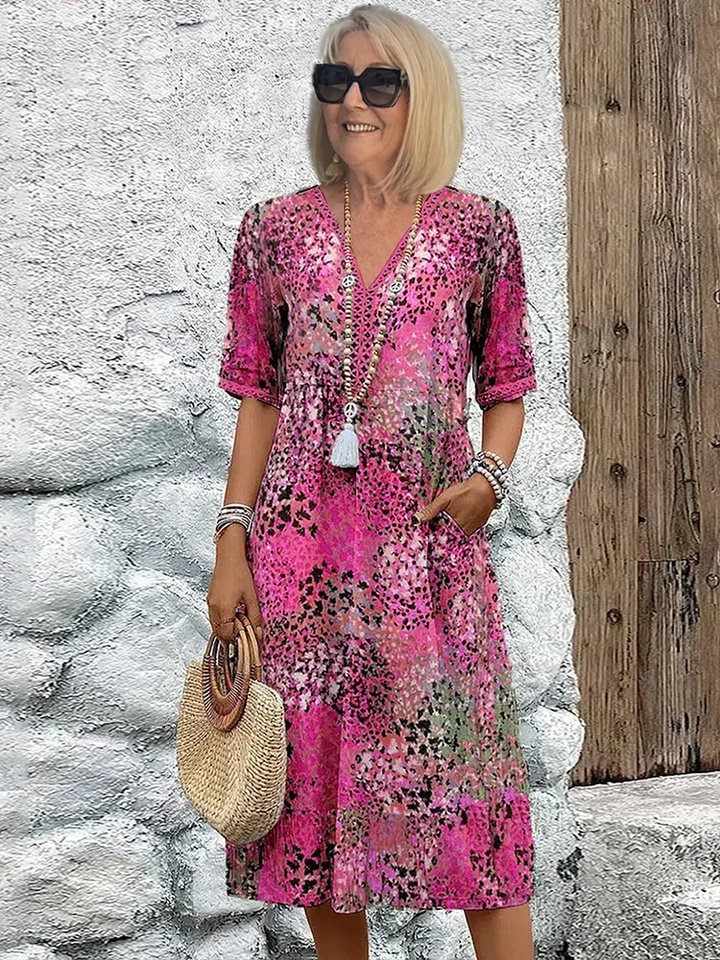 Comfortable women's floral print midi dress with a flattering V-neck, perfect for versatile everyday style.