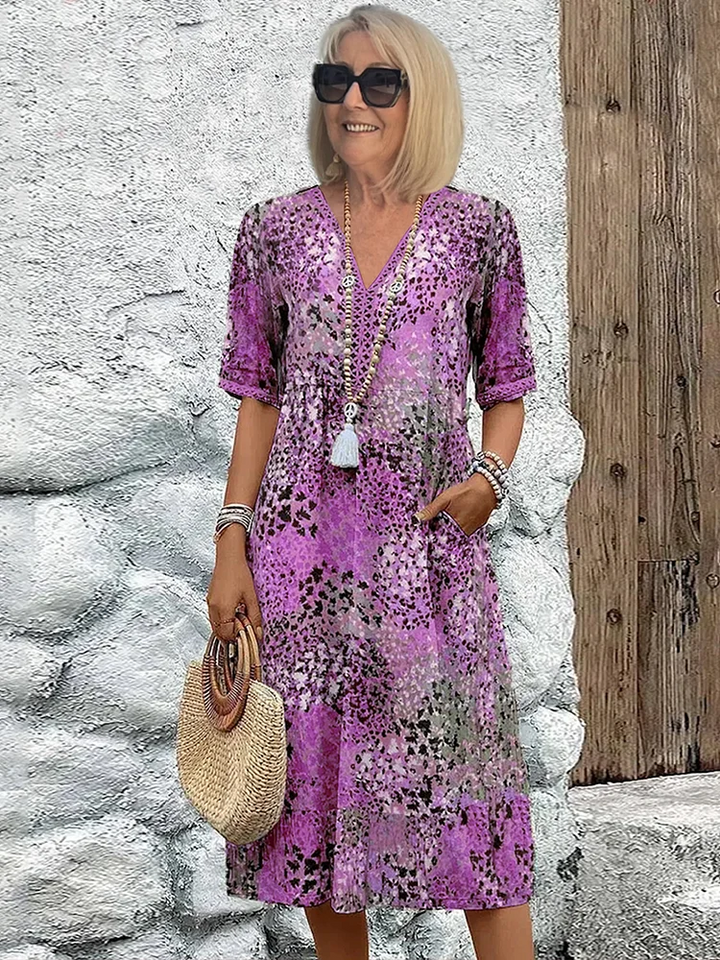 Feminine women's V-neck midi dress in a pretty floral print. An effortless and comfortable casual summer outfit.