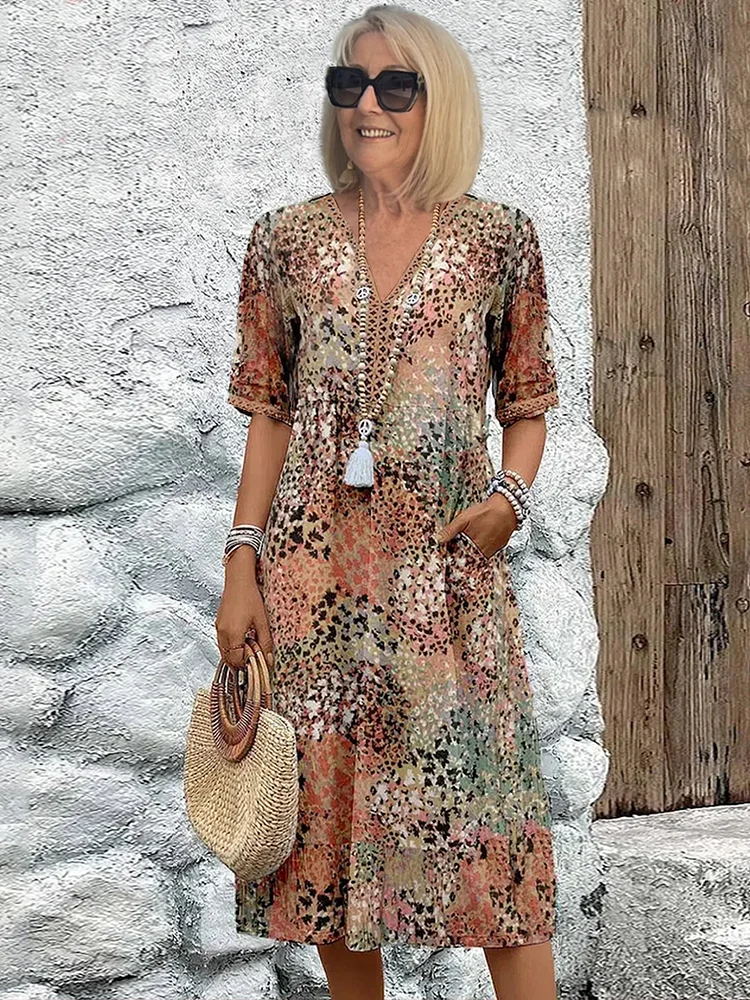 Stylish women's floral midi dress with an elegant V-neck, designed for comfortable, casual summer wear.