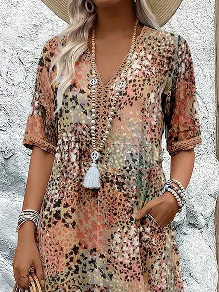 Effortless women's summer midi dress featuring a beautiful floral print and flattering V-neckline.
