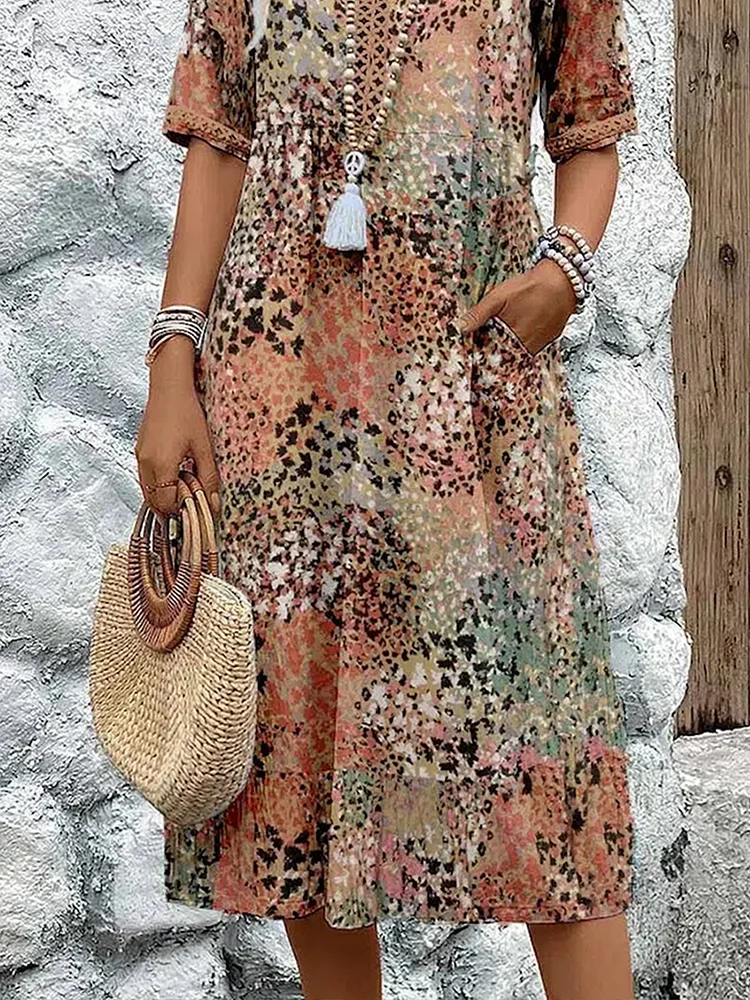 Women's V-neck midi dress with a delicate floral print. A comfortable and versatile A-line dress for summer.