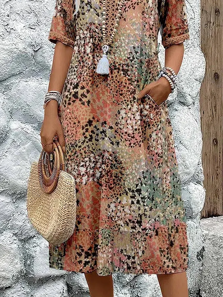 Women's V-neck midi dress with a delicate floral print. A comfortable and versatile A-line dress for summer.
