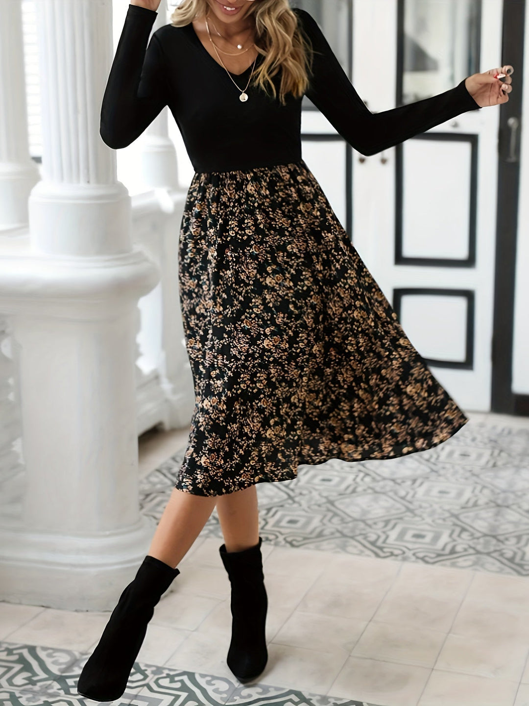 Women's floral print V-neck midi dress with long sleeves, perfect for spring or fall fashion.