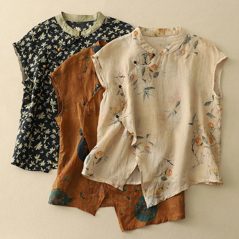Casual women's sleeveless blouse with vibrant floral print, mandarin collar & front button placket.