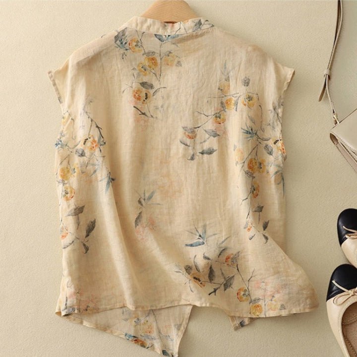 Stylish women's floral sleeveless top. Elegant print, relaxed fit, mandarin collar, & comfortable for summer.