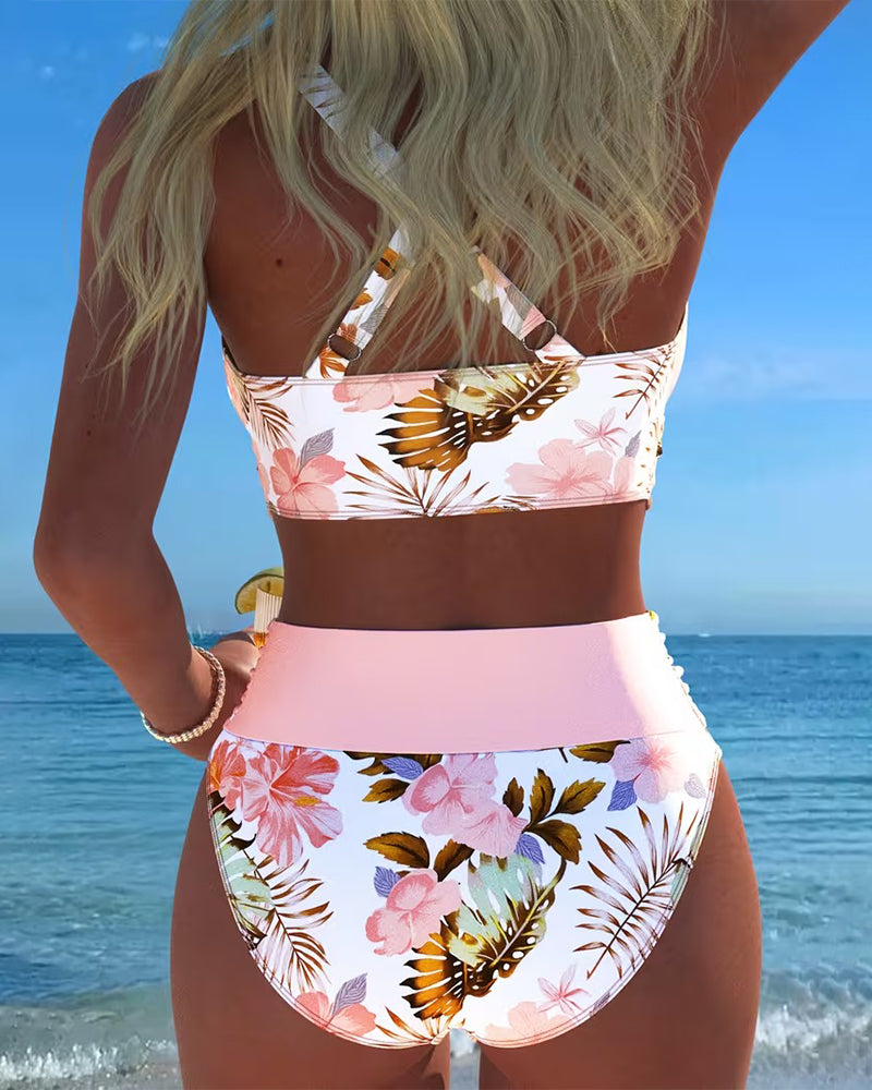 Vibrant floral patterned bikini, a trendy women's split swimsuit ideal for beachwear.