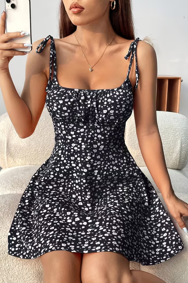 Women's floral strapless slip dress for summer parties. Elegant mini vacation dress with vibrant print.