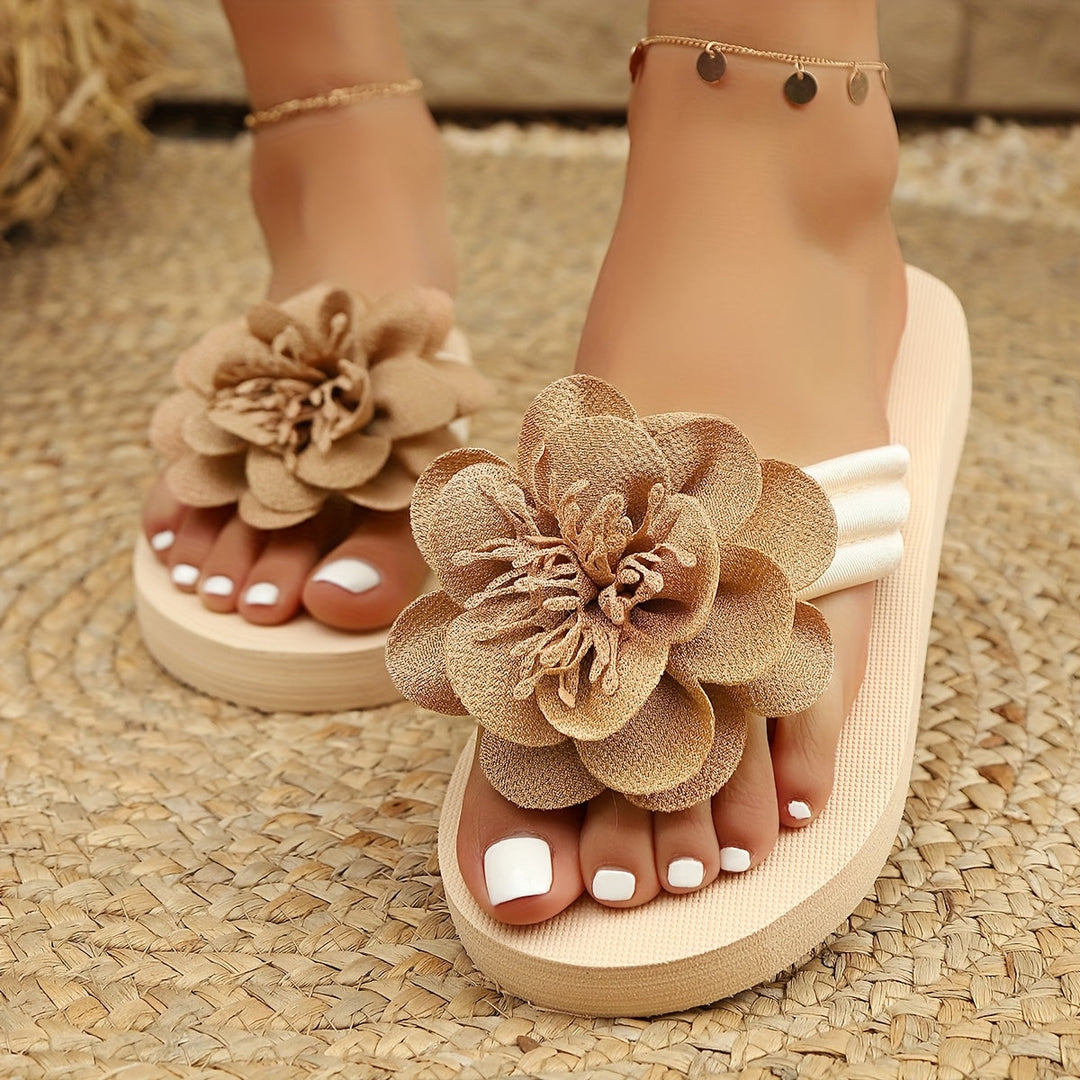 Floral sandals for women, yellow with cheerful flower design, on sand, ideal for summer, comfort