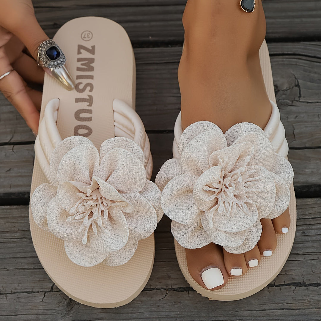 Stylish women's floral detail summer slippers, beige with pink flower accents, top-down view, casual, comfy