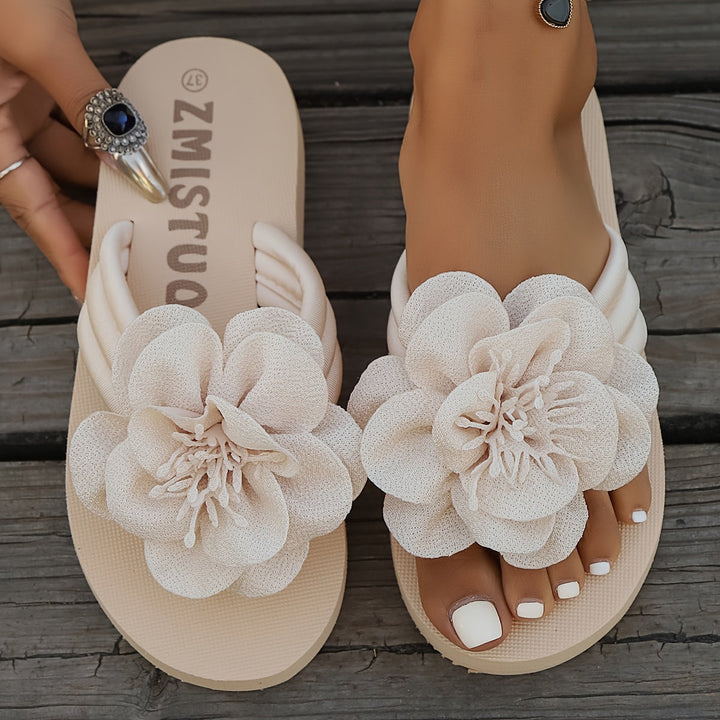 Stylish women's floral detail summer slippers, beige with pink flower accents, top-down view, casual, comfy