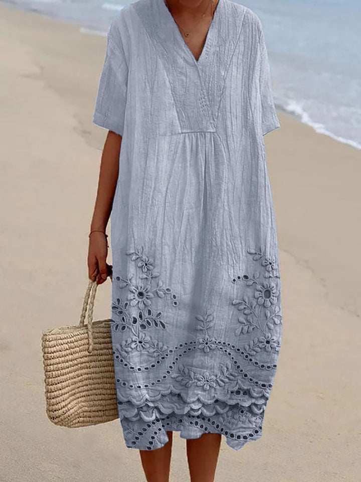 Chic women's midi dress with a flowing, relaxed fit. Versatile for summer, beach, or casual wear. Comfortable bohemian style.