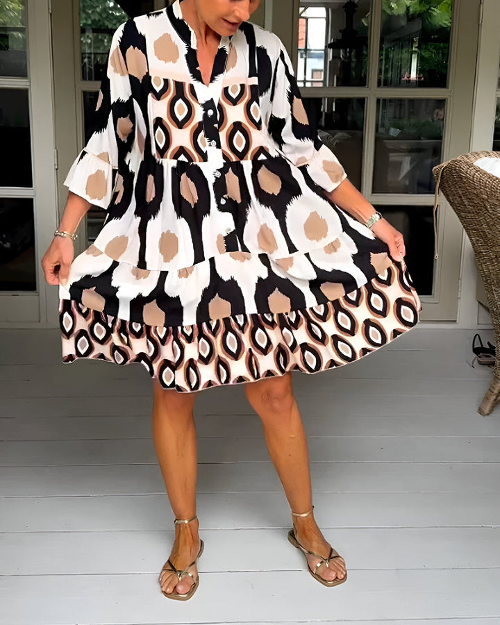 Casual women's A-line bohemian dress featuring a tiered geometric print, ideal for spring & summer wear.