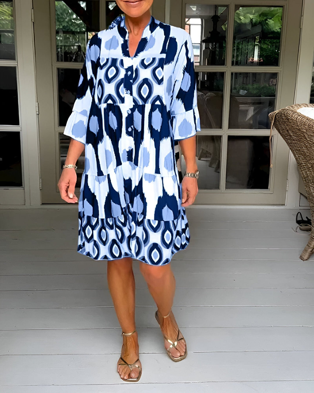 Flowing women's bohemian midi dress with a stylish geometric print and tiered design, suitable for casual occasions.