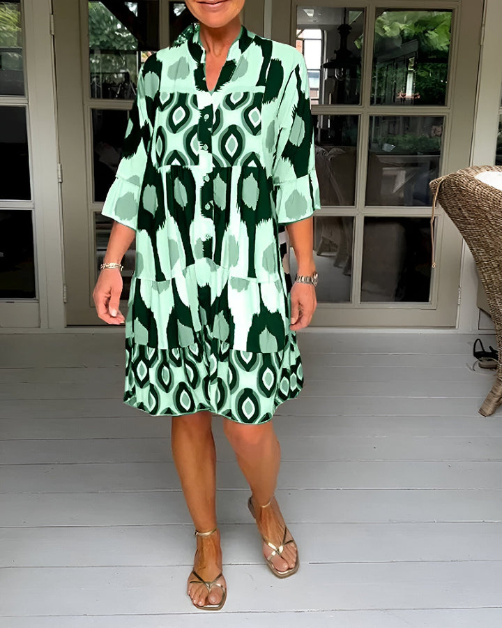 Women's spring bohemian tiered dress showcasing a vibrant geometric print, A-line cut, and comfortable fit.