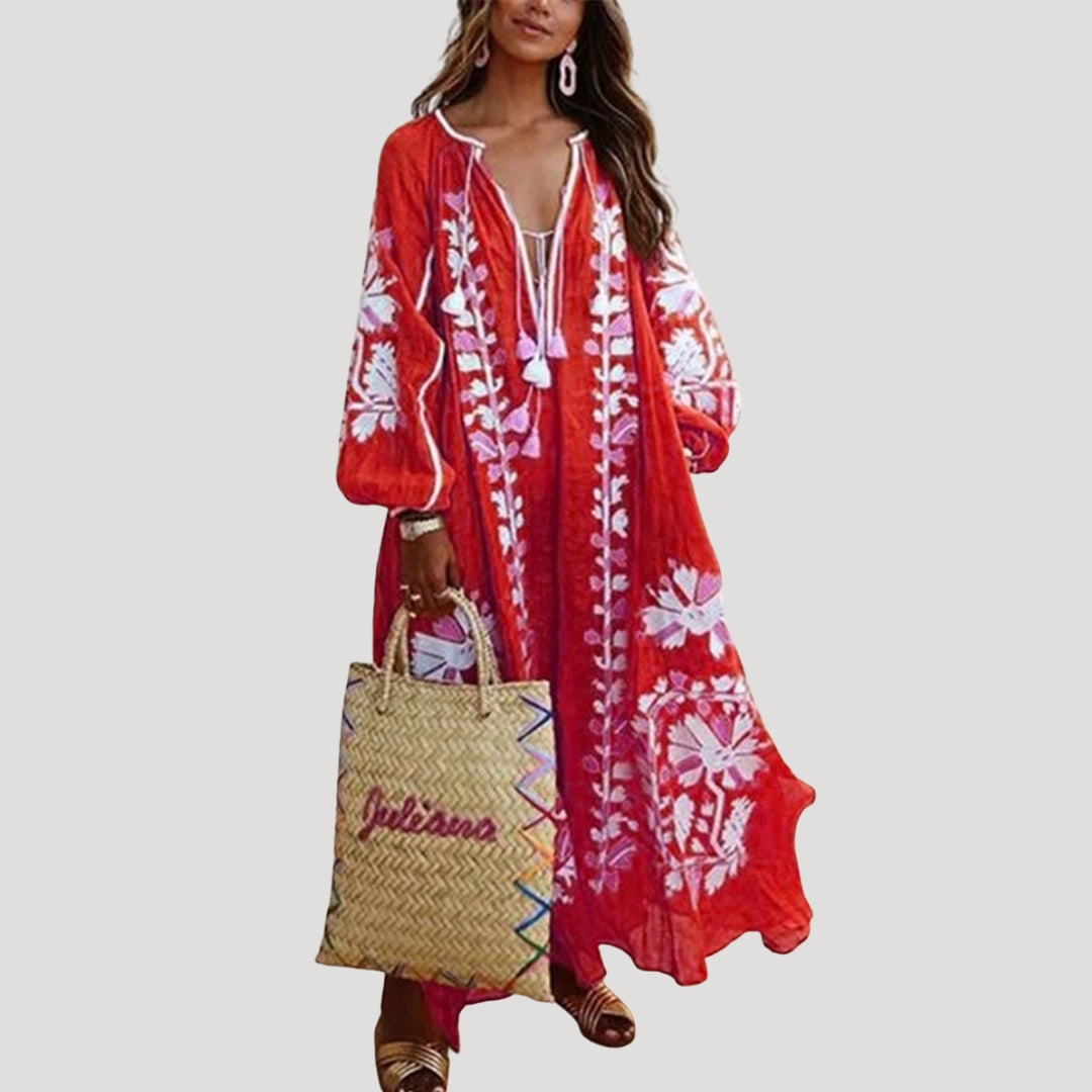 Women's flowing boho maxi dress with V-neck, long sleeves, and vibrant print. Perfect for casual wear & vacation.