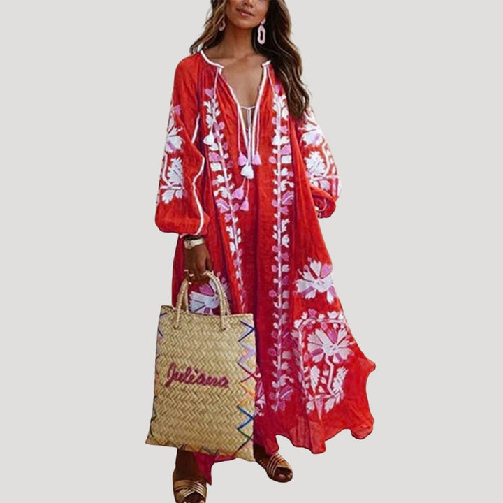 Women's flowing boho maxi dress with V-neck, long sleeves, and vibrant print. Perfect for casual wear & vacation.