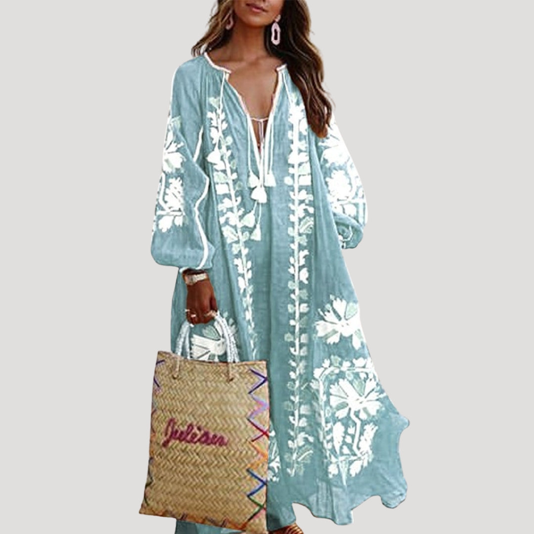 Printed V-neck maxi dress with long sleeves, offering a loose, flowy fit; ideal for a stylish spring or summer look.