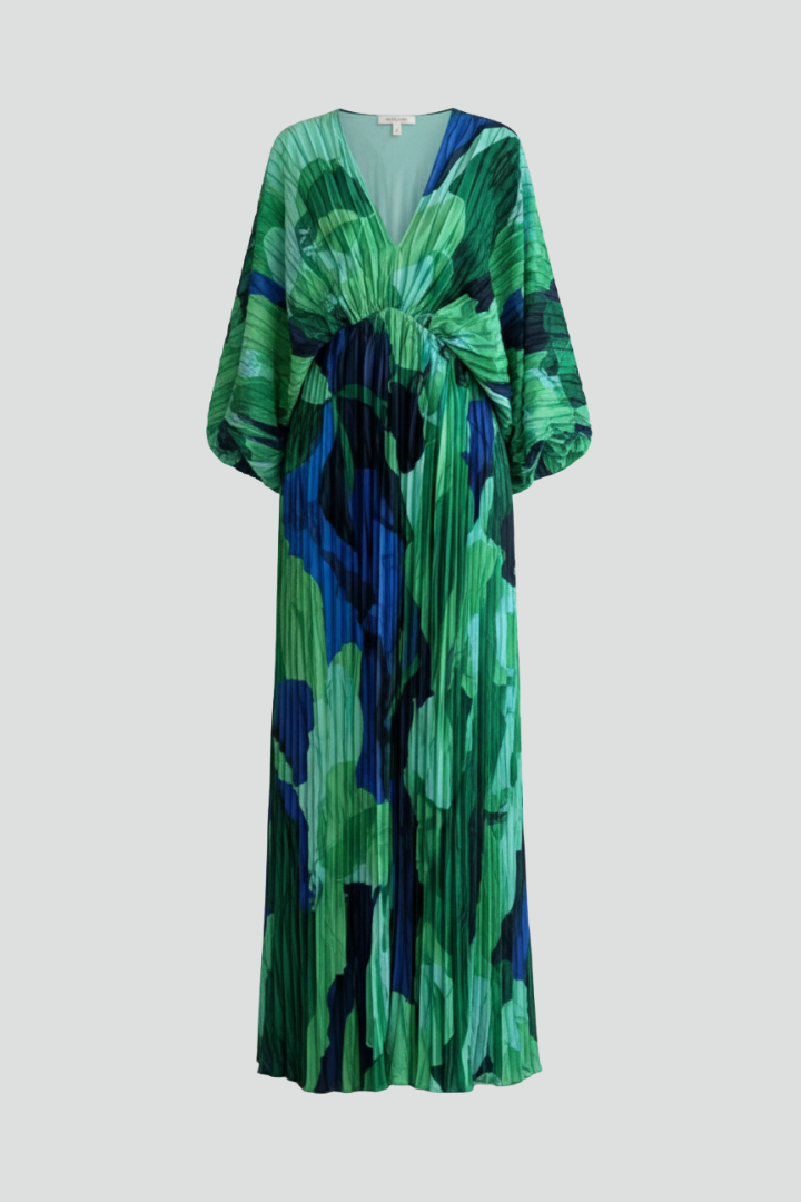Women's flowing pleated maxi dress with elegant V-neck and stylish side slit, perfect for formal or casual wear.