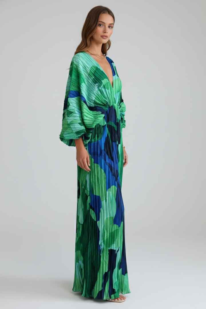 Comfortable flowing pleated maxi dress for women, featuring a flattering V-neck and a fashionable side slit.