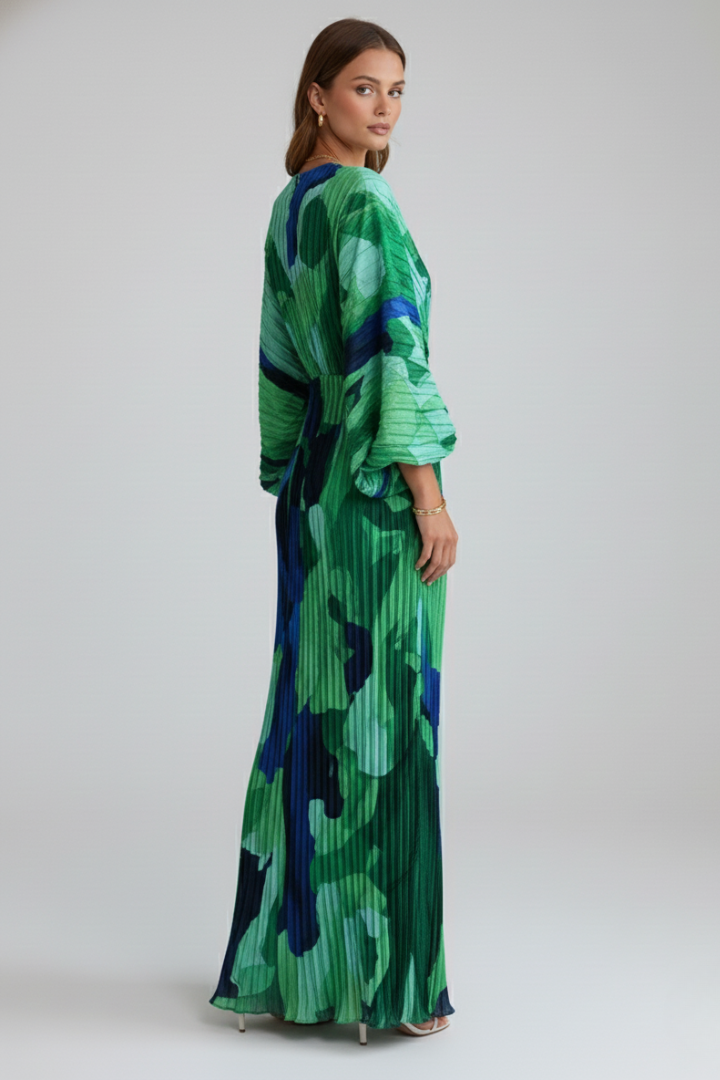 Beautiful women's flowing pleated maxi dress with a V-neckline and side slit, versatile for summer, evening, or vacation.