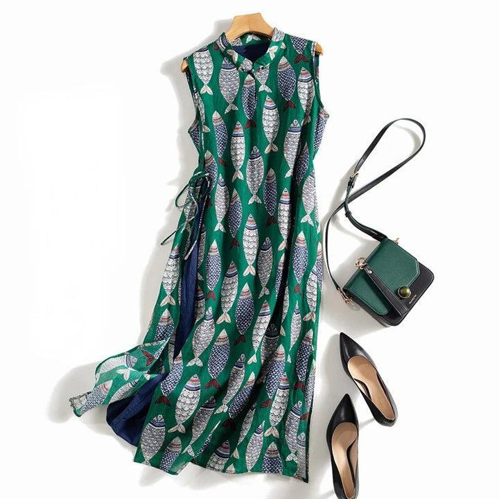 Women's flowing sleeveless maxi dress featuring a unique, playful fish print for casual summer elegance.