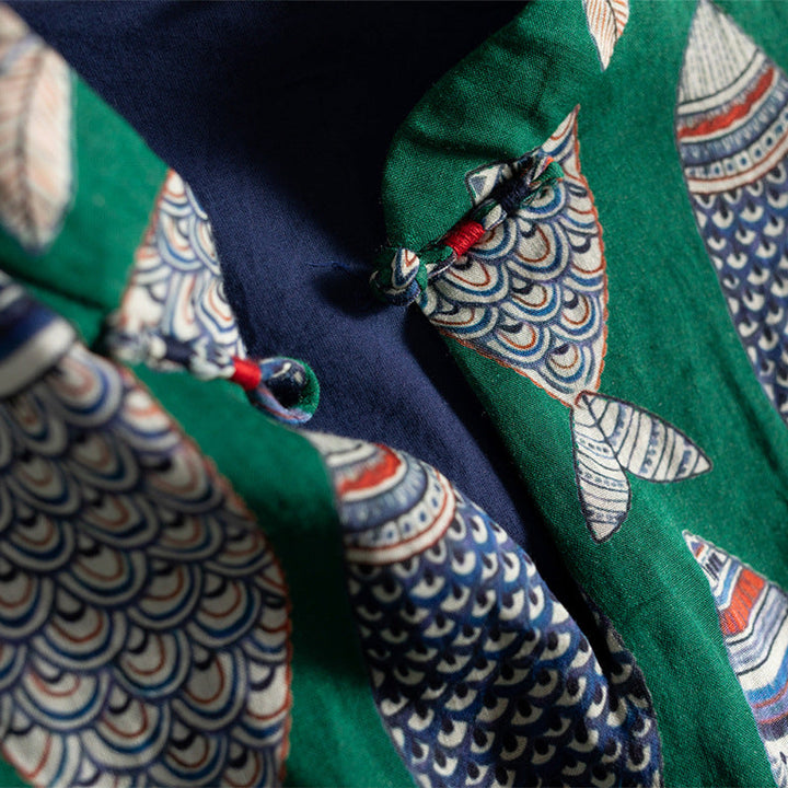 Elegant women's sleeveless maxi dress with a playful fish motif, perfect for summer casual or beach outings.