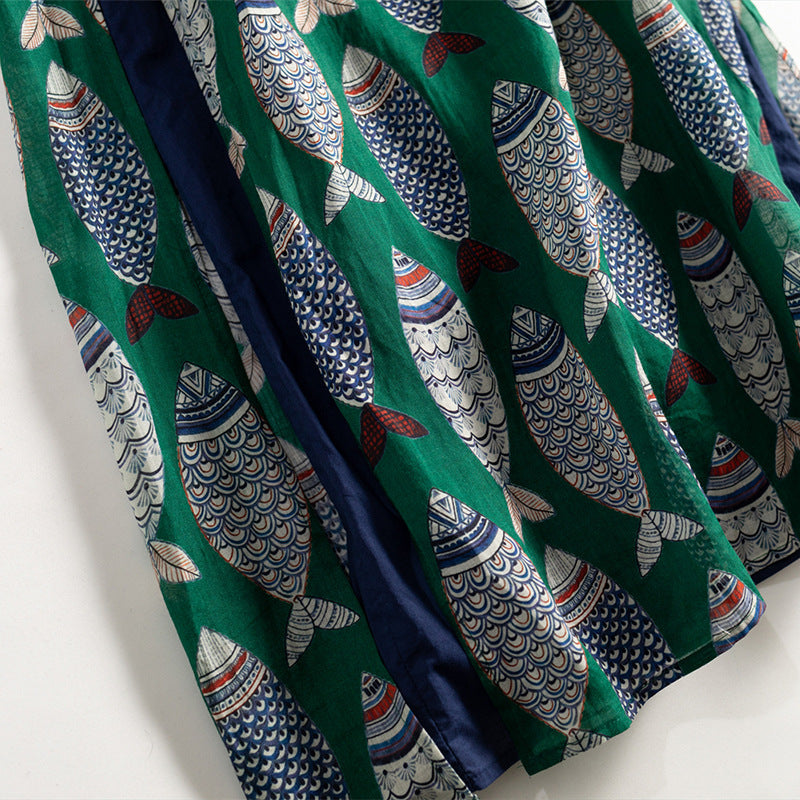 Unique women's maxi dress: flowing silhouette, sleeveless, and adorned with an eye-catching playful fish print.