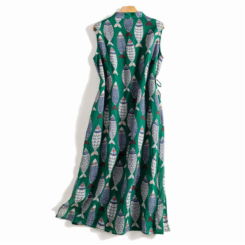 Casual summer women's dress, long and flowing, with a vibrant, playful fish print on a sleeveless design.