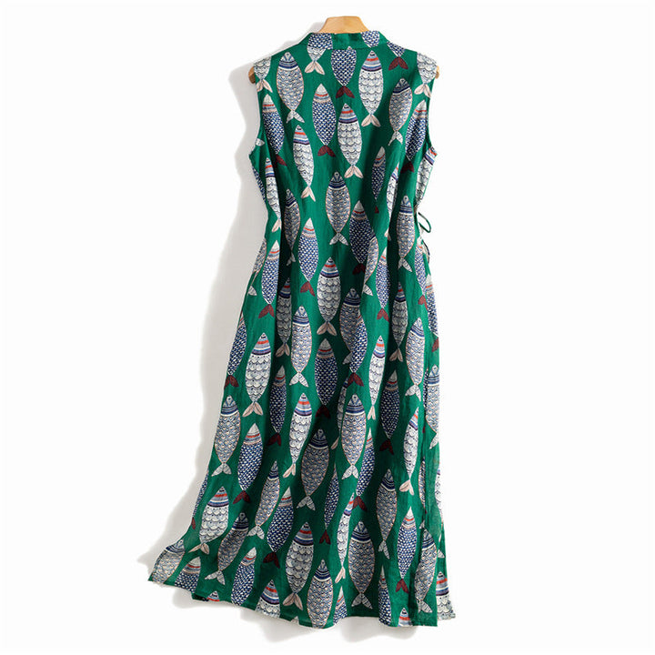 Casual summer women's dress, long and flowing, with a vibrant, playful fish print on a sleeveless design.