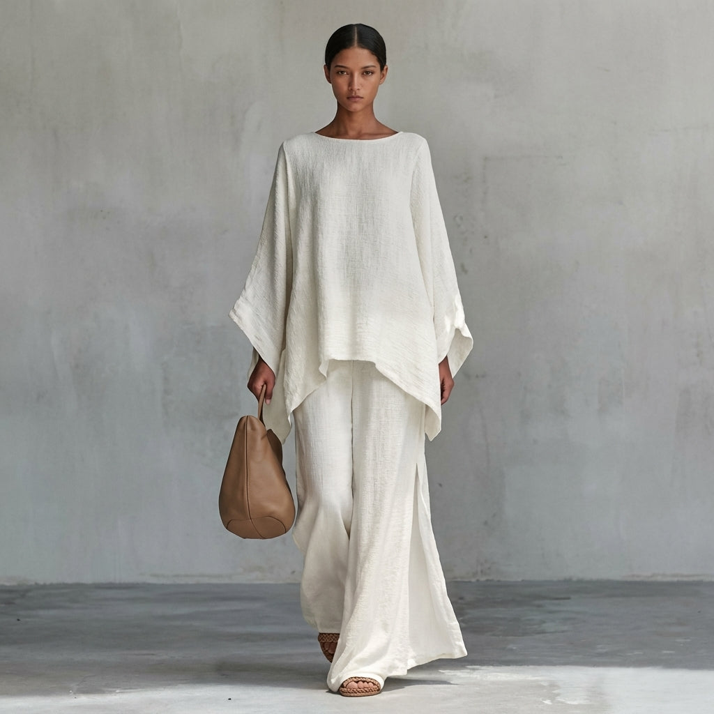 Women's flowing two-piece set with oversized tunic top and maxi skirt, ideal for elegant resort wear.
