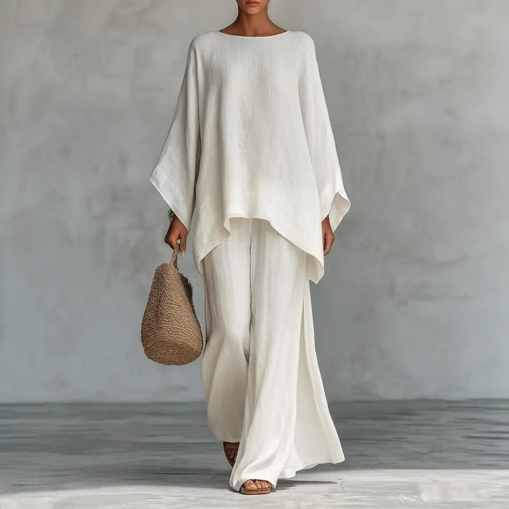 Relaxed fit women's two-piece set featuring a chic tunic top and elegant flowing maxi skirt for vacation.