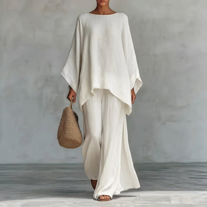 Relaxed fit women's two-piece set featuring a chic tunic top and elegant flowing maxi skirt for vacation.