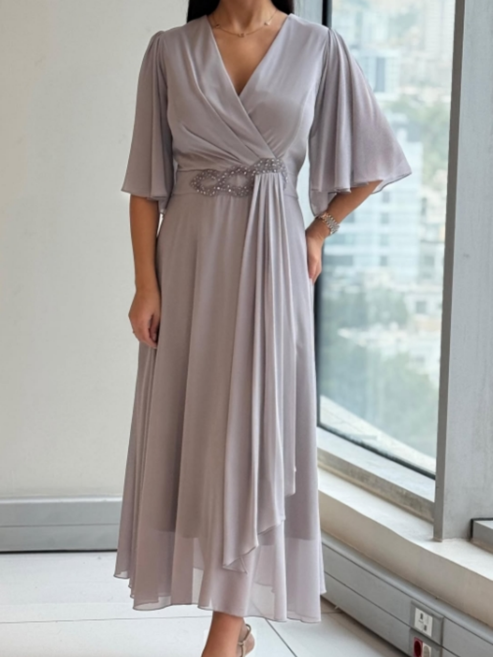 Women's flowing V-neck maxi dress with adjustable straps, perfect for summer, resort, or casual wear.