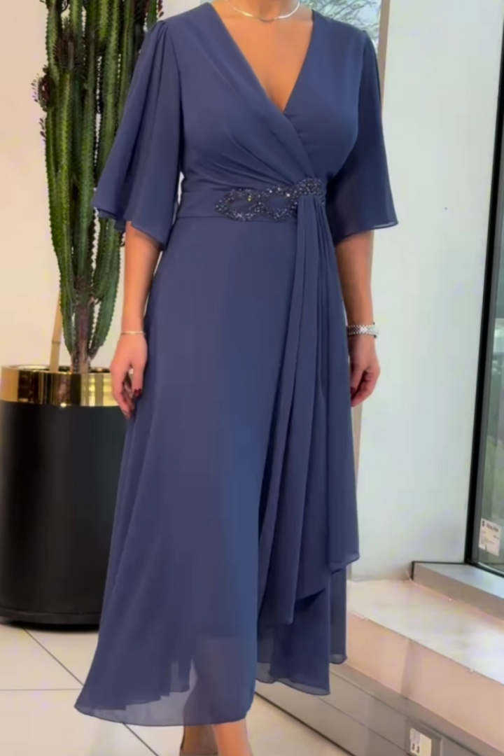 Elegant women's V-neck maxi dress, flowing silhouette & adjustable straps. Ideal for evening or versatile resort wear.