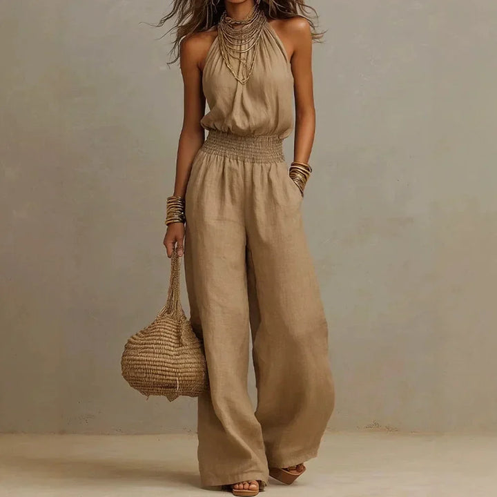 Women's flowing wide leg halter jumpsuit, perfect for summer comfort and relaxed vacation style.