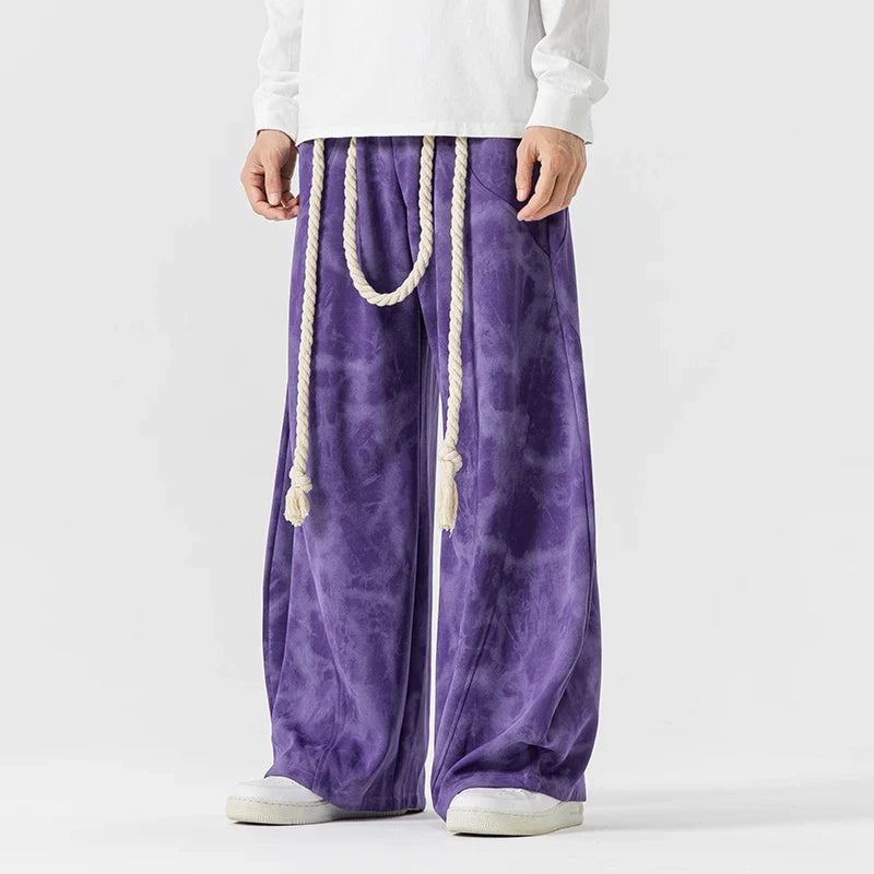 Women's flowing wide-leg pants with a stylish rope belt, perfect for comfortable and relaxed fashion.