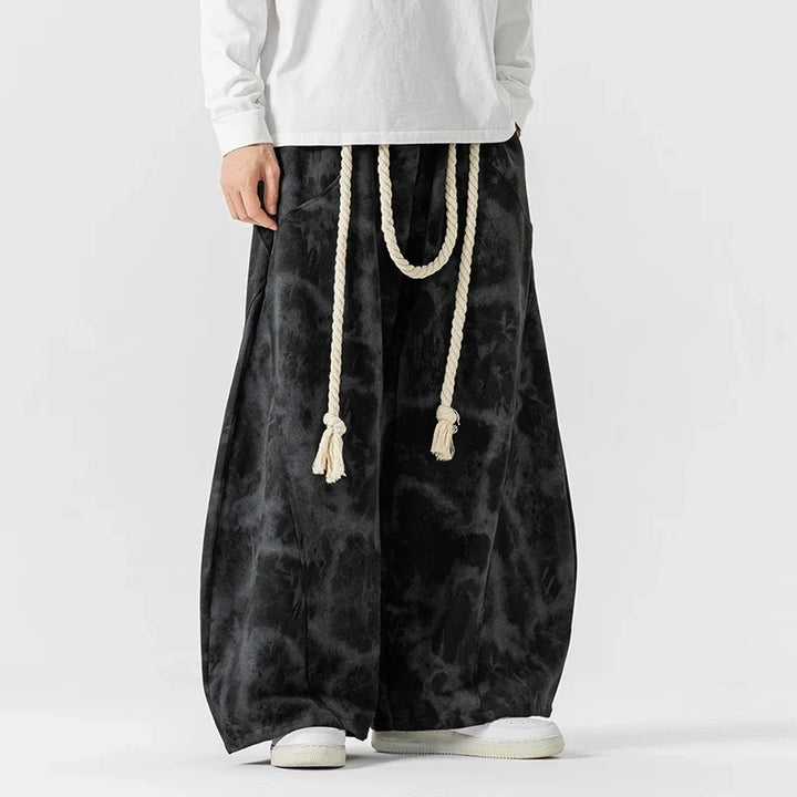 Comfortable wide-leg pants for women, accented with a trendy rope belt; ideal for stylish, relaxed wear.