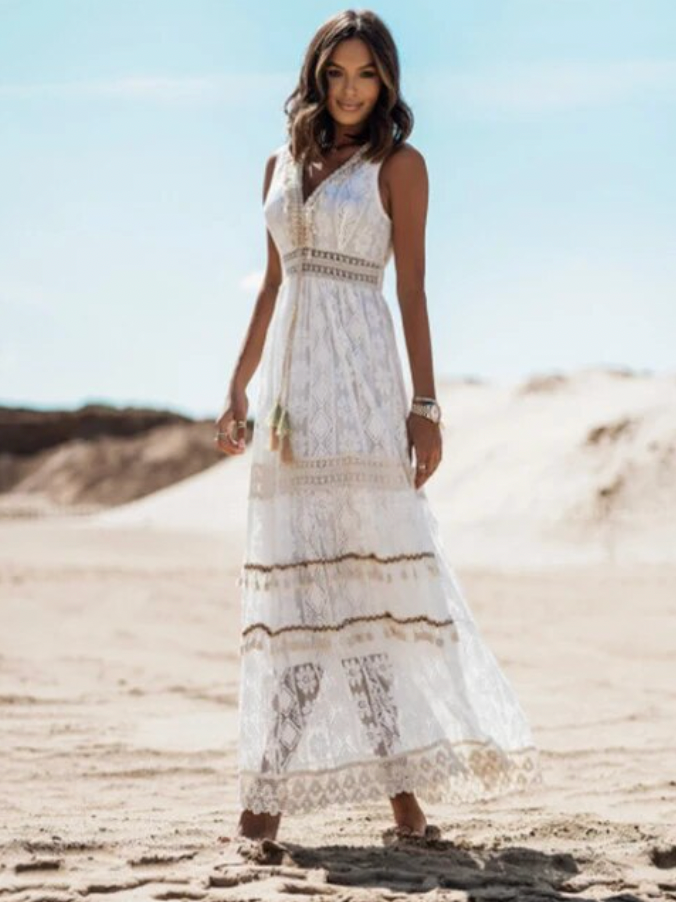 Elegant Women's Flowy Bohemian Maxi Dress with a V-neck, ideal for casual summer resort wear.