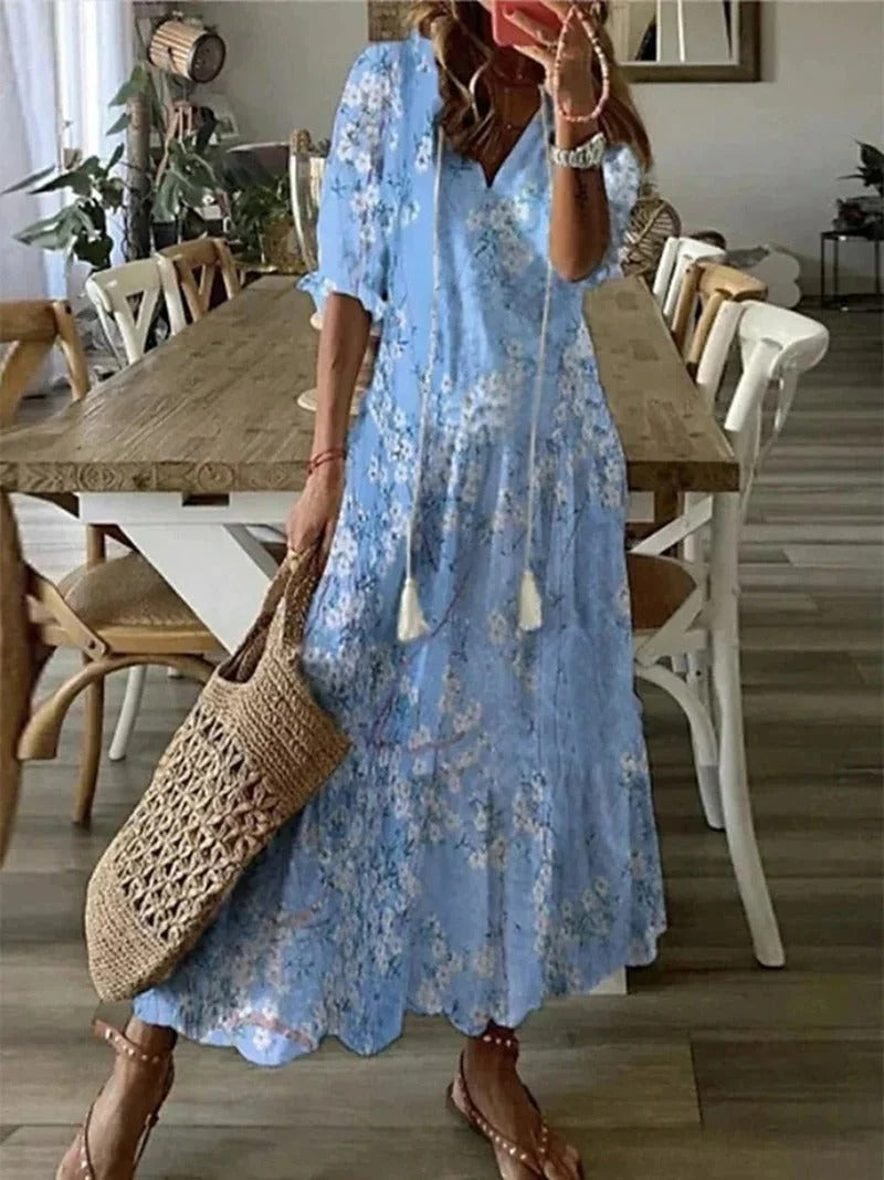 Elegant bohemian style women's long patterned dress, ideal for resort wear or summer outings.