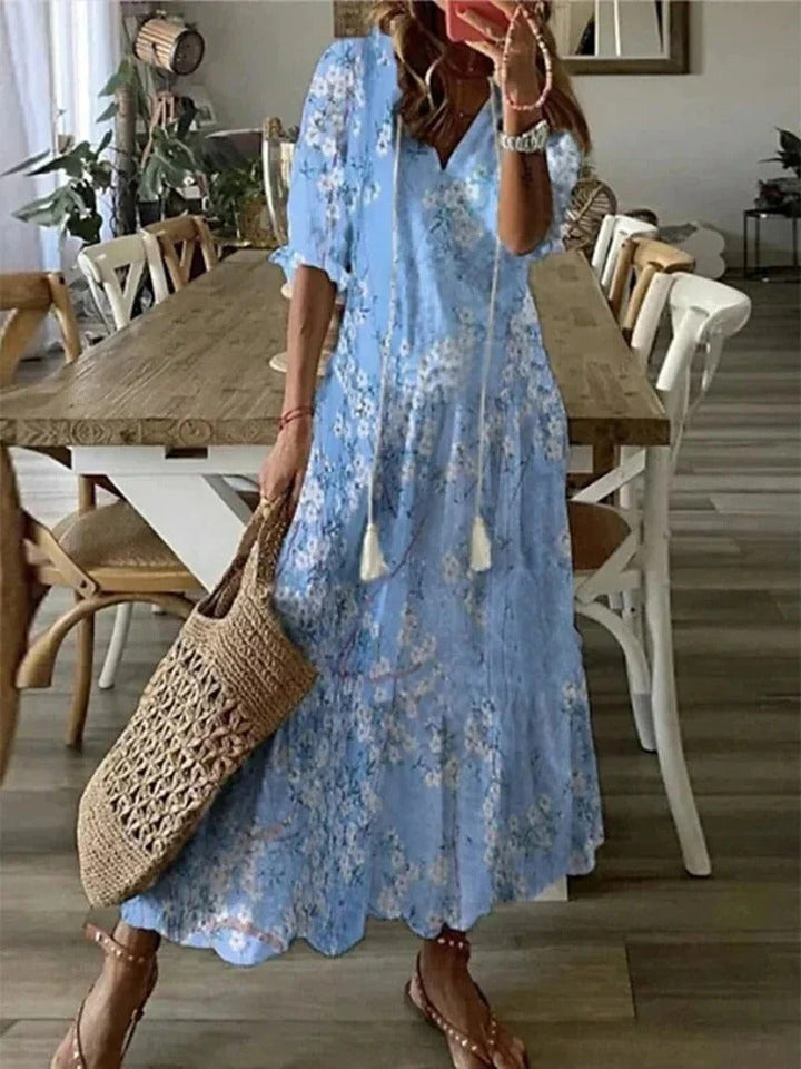 Elegant bohemian style women's long patterned dress, ideal for resort wear or summer outings.
