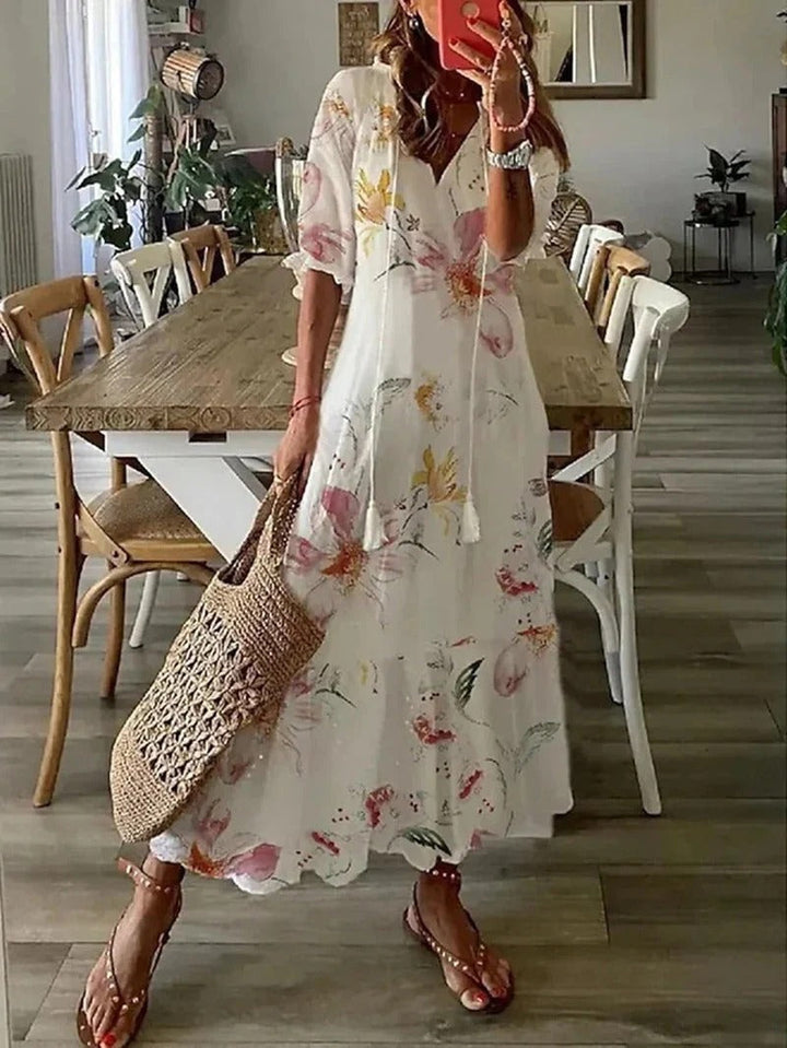 Effortless women's casual boho maxi dress with V-neck, three-quarter sleeves & flowy design.