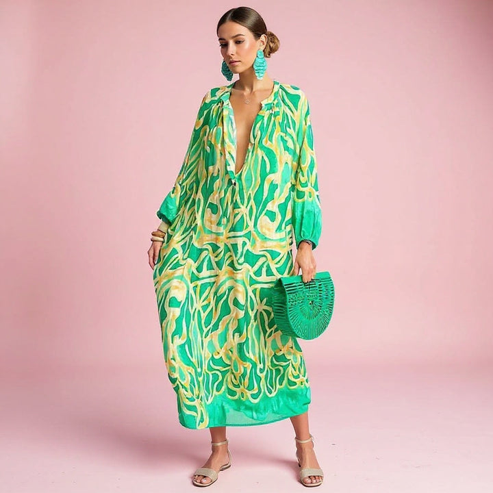 Women's flowy boho print maxi dress for summer. Comfortable, elegant patterned long dress, ideal for vacation wear.